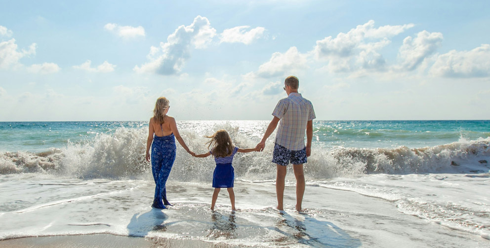 General insurance image couple and child holding hands