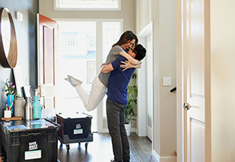 Mortgages couple in hallway of their new house
